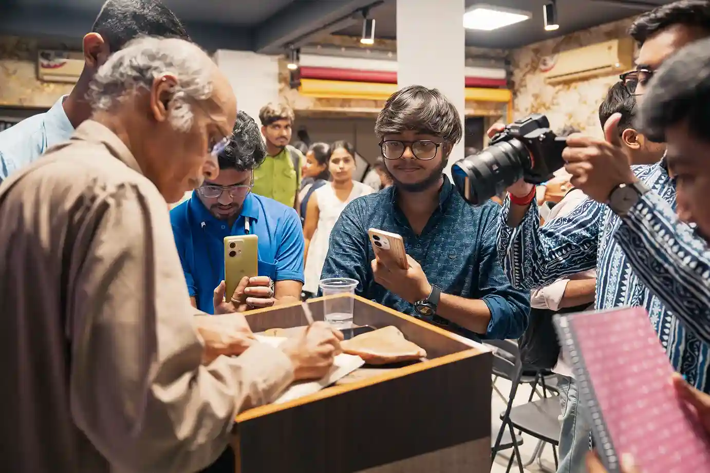 Students practising with their cameras at a RAP Education session in Kolkata